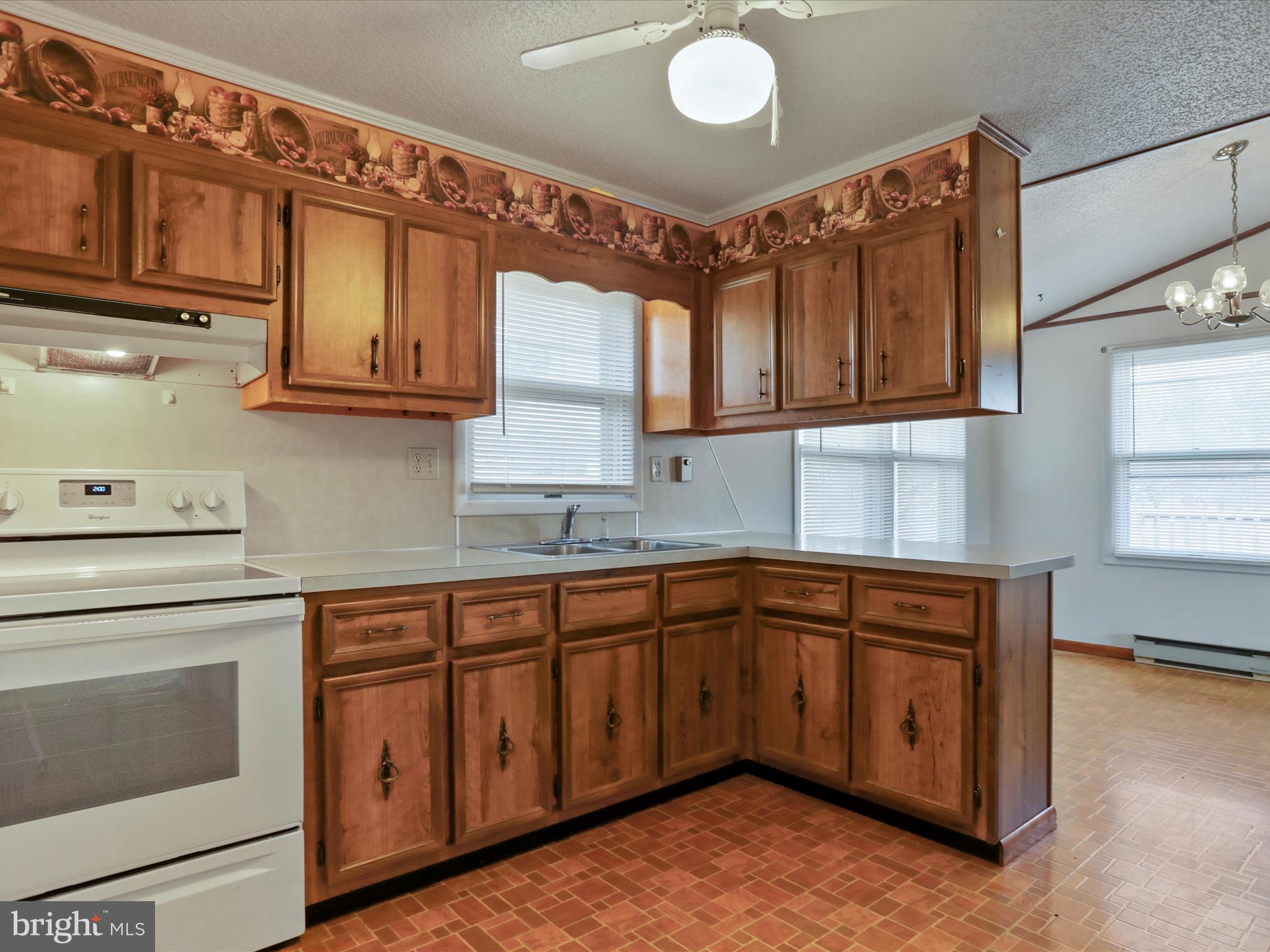 101 Carvers Way Falling Waters, WV 25419 - Photo 11 of 37 a kitchen with stainless steel appliances granite countertop a sink and cabinets