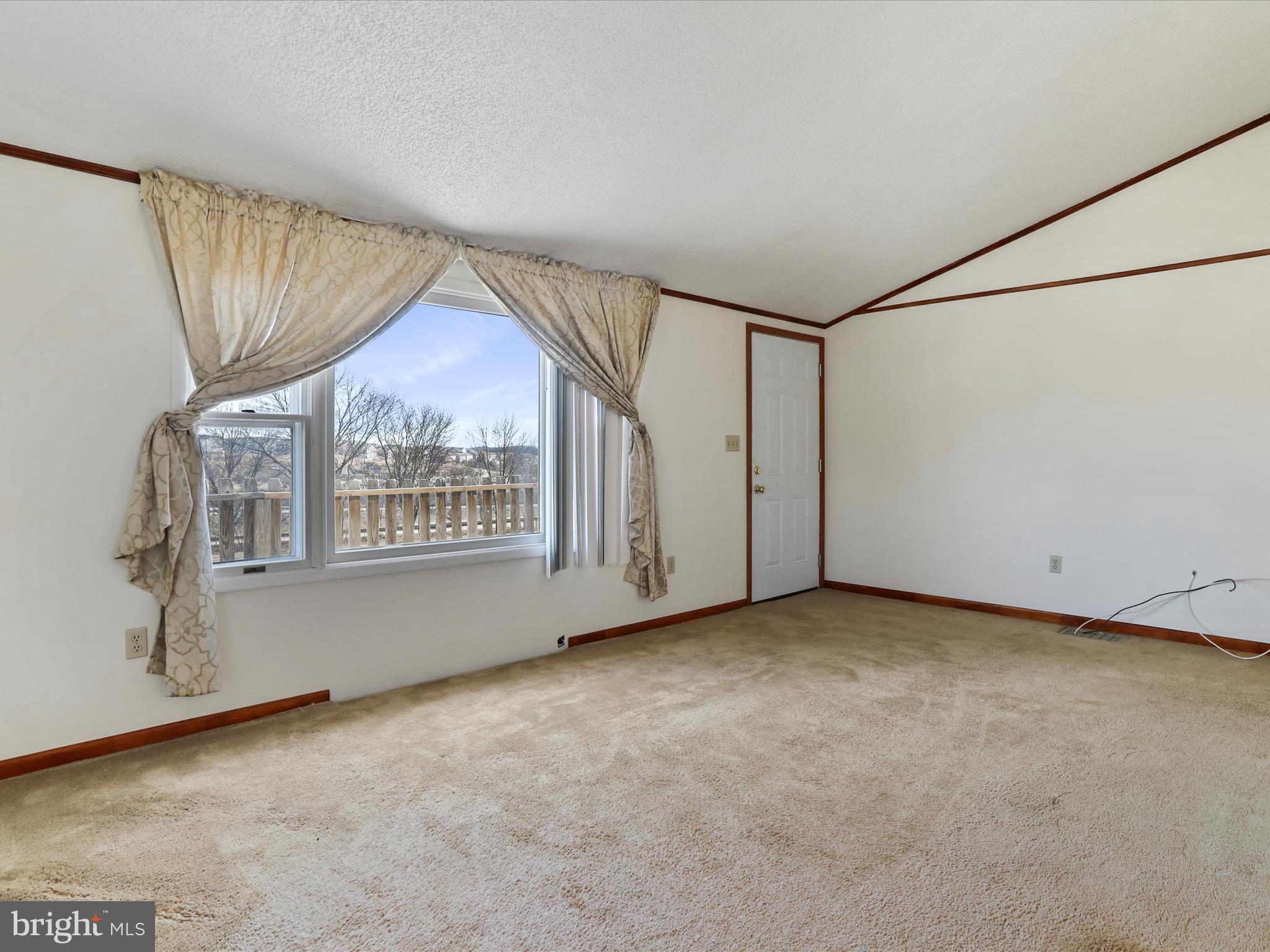 101 Carvers Way Falling Waters, WV 25419 - Photo 4 of 37 a view of an empty room with a window