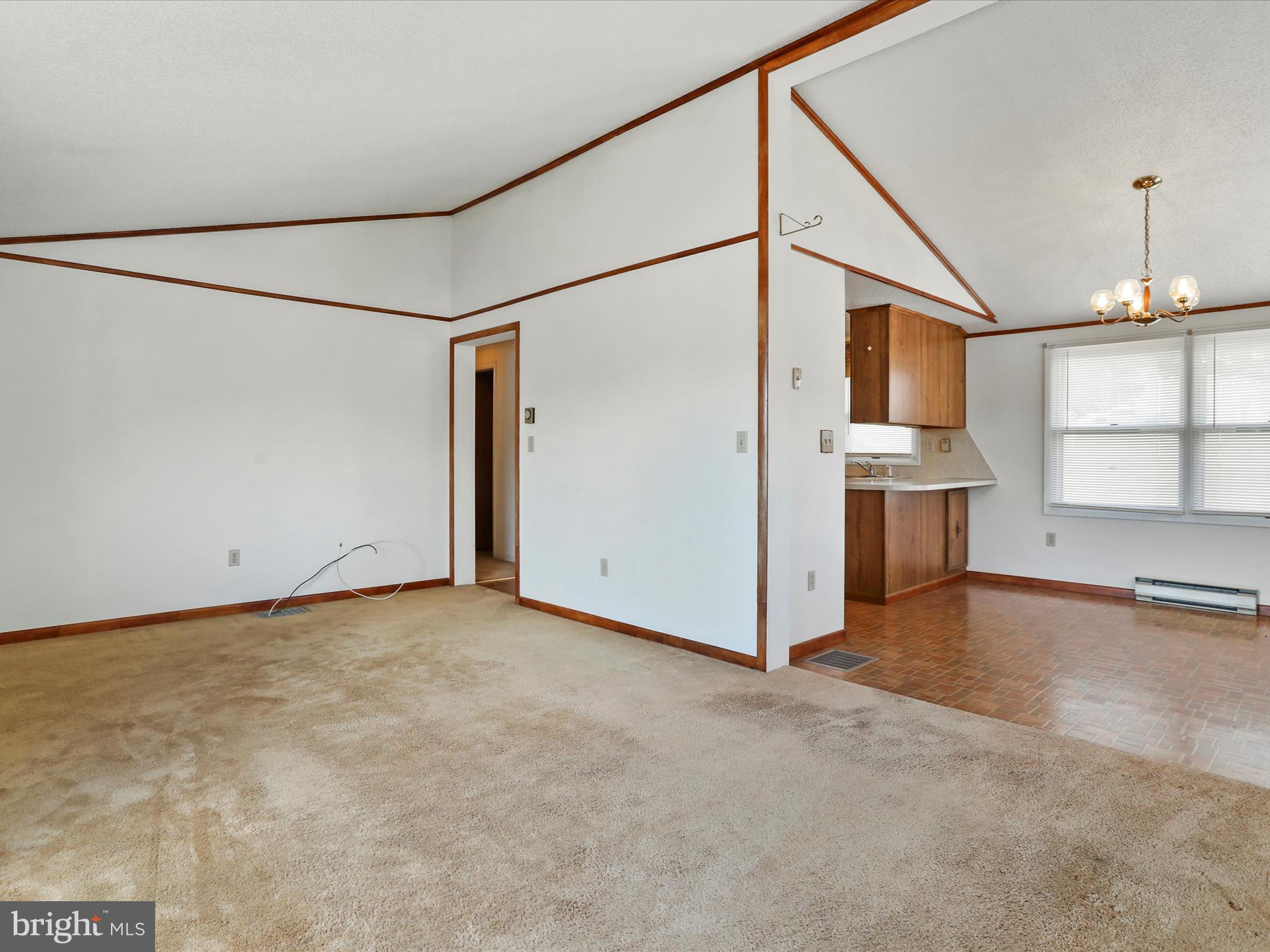 101 Carvers Way Falling Waters, WV 25419 - Photo 5 of 37 an empty room with cabinet and windows
