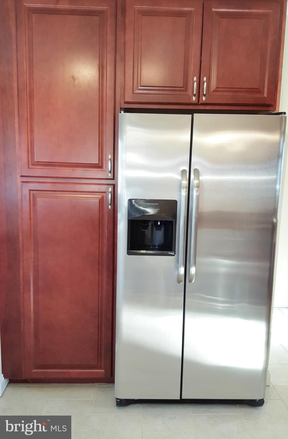 7810 Blue Grass Road Baltimore, MD 21237 - Photo 17 of 30 Side-by-side SS Fridge, Large Pantry Cabinets