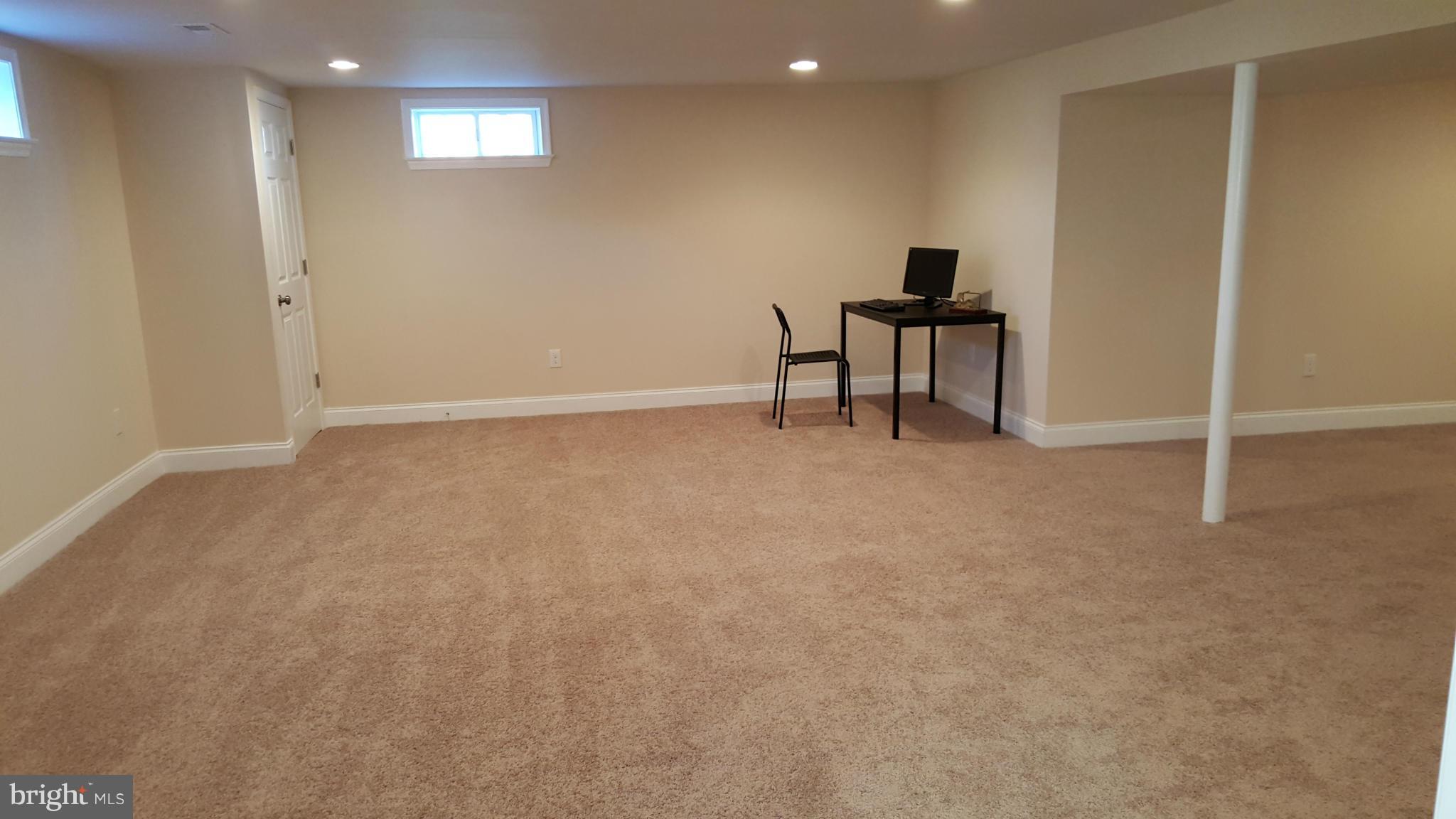 7810 Blue Grass Road Baltimore, MD 21237 - Photo 22 of 30 Great Room in the Basement