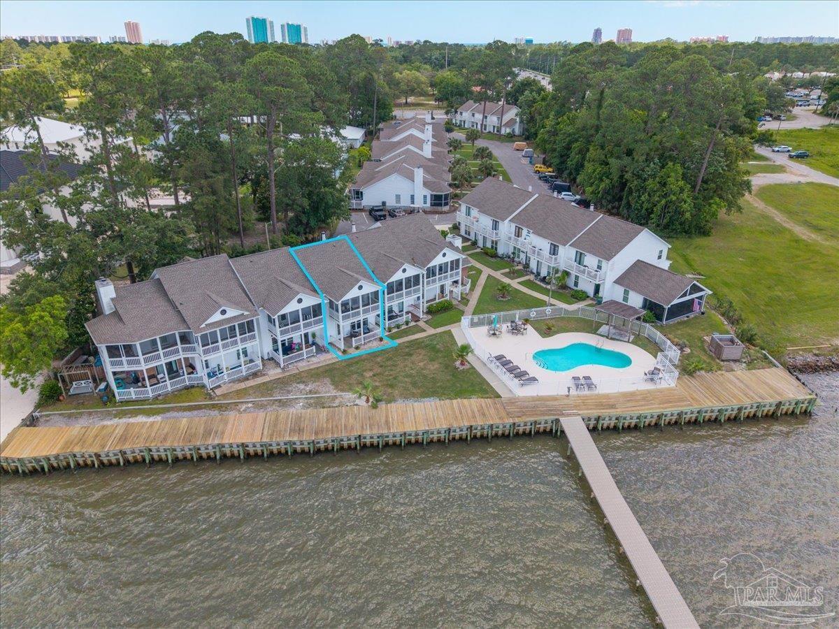 26063 Canal Road, Unit 3F Orange Beach, AL 36561 - Photo 1 of 72 an aerial view of a house with a garden and lake view