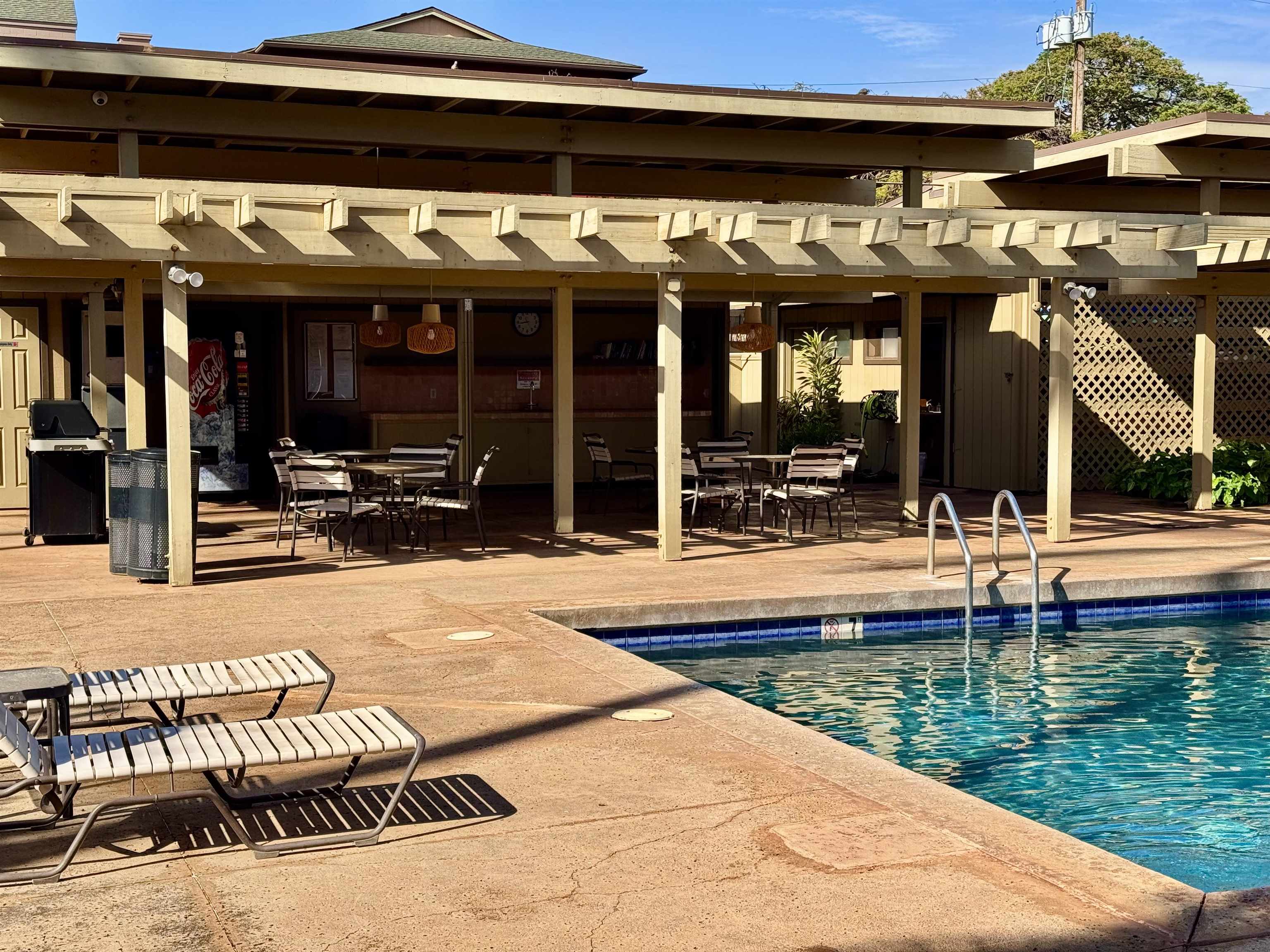 3559 Lower Honoapiilani Road, Unit 2D Lahaina, HI 96761 - Photo 12 of 16 a view of a swimming pool with a patio