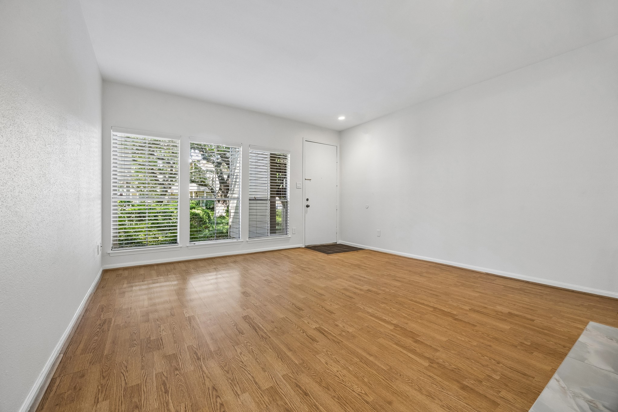 Spacious Living Room with View to the Lush Courtyard