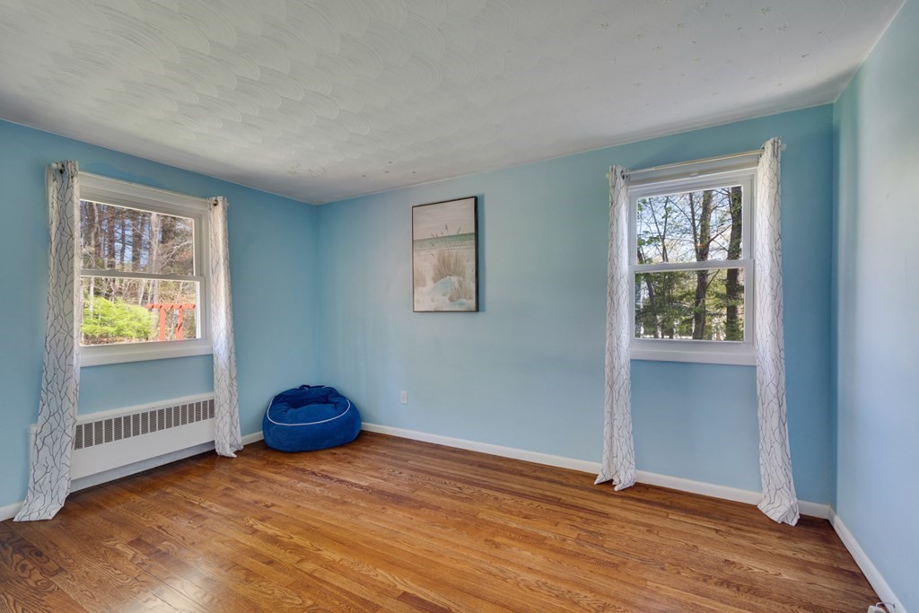 4 Duggan Road Acton, MA 01720 - Photo 11 of 21 a view of room with window and wooden floor