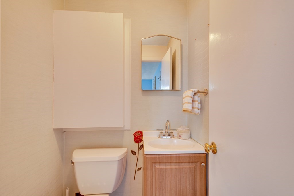 4 Duggan Road Acton, MA 01720 - Photo 14 of 21 a bathroom with a sink toilet and a mirror