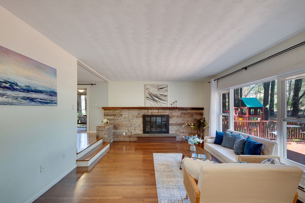 4 Duggan Road Acton, MA 01720 - Photo 4 of 21 a living room with furniture and a fireplace