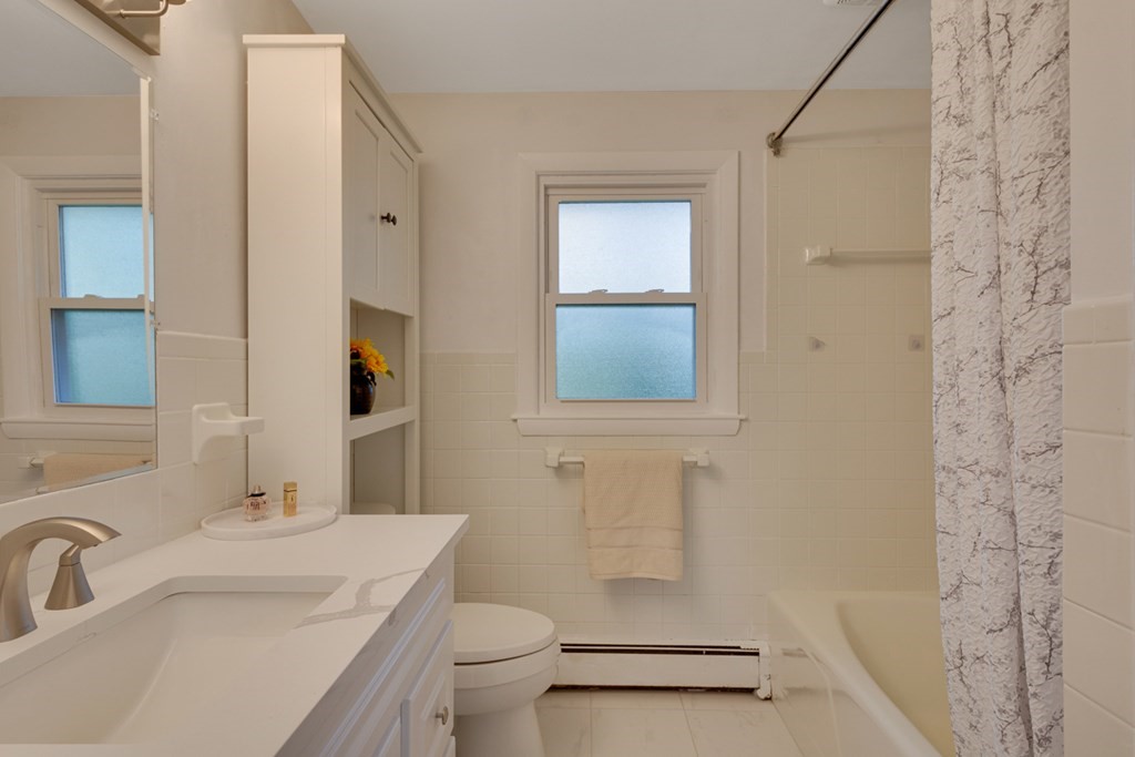 4 Duggan Road Acton, MA 01720 - Photo 10 of 21 a bathroom with a sink toilet and shower