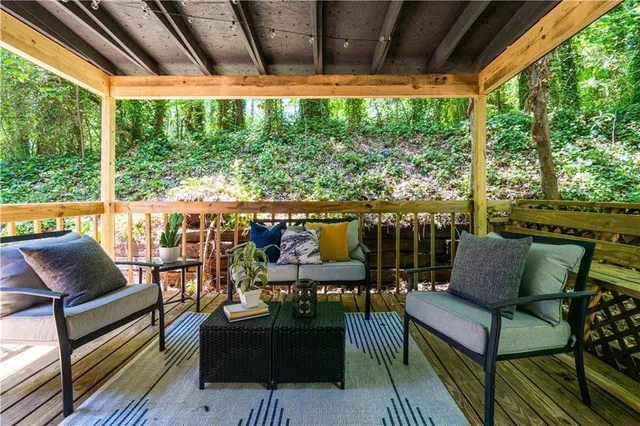 a outdoor living space with patio furniture and a potted plant