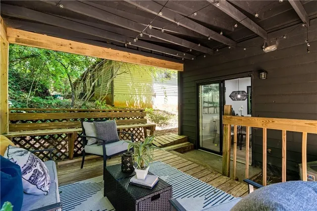 a bathroom with a sink a toilet and a window
