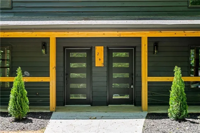 a view of a entryway door front of a house