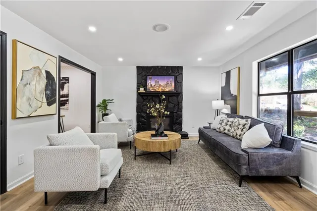a living room with furniture and a large window