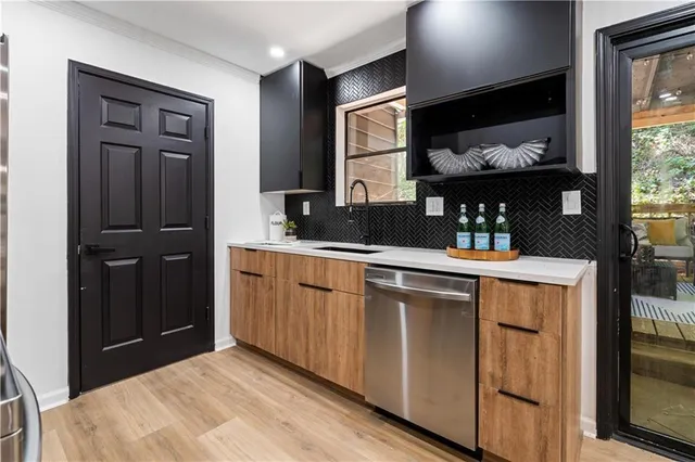a kitchen with a sink and cabinets