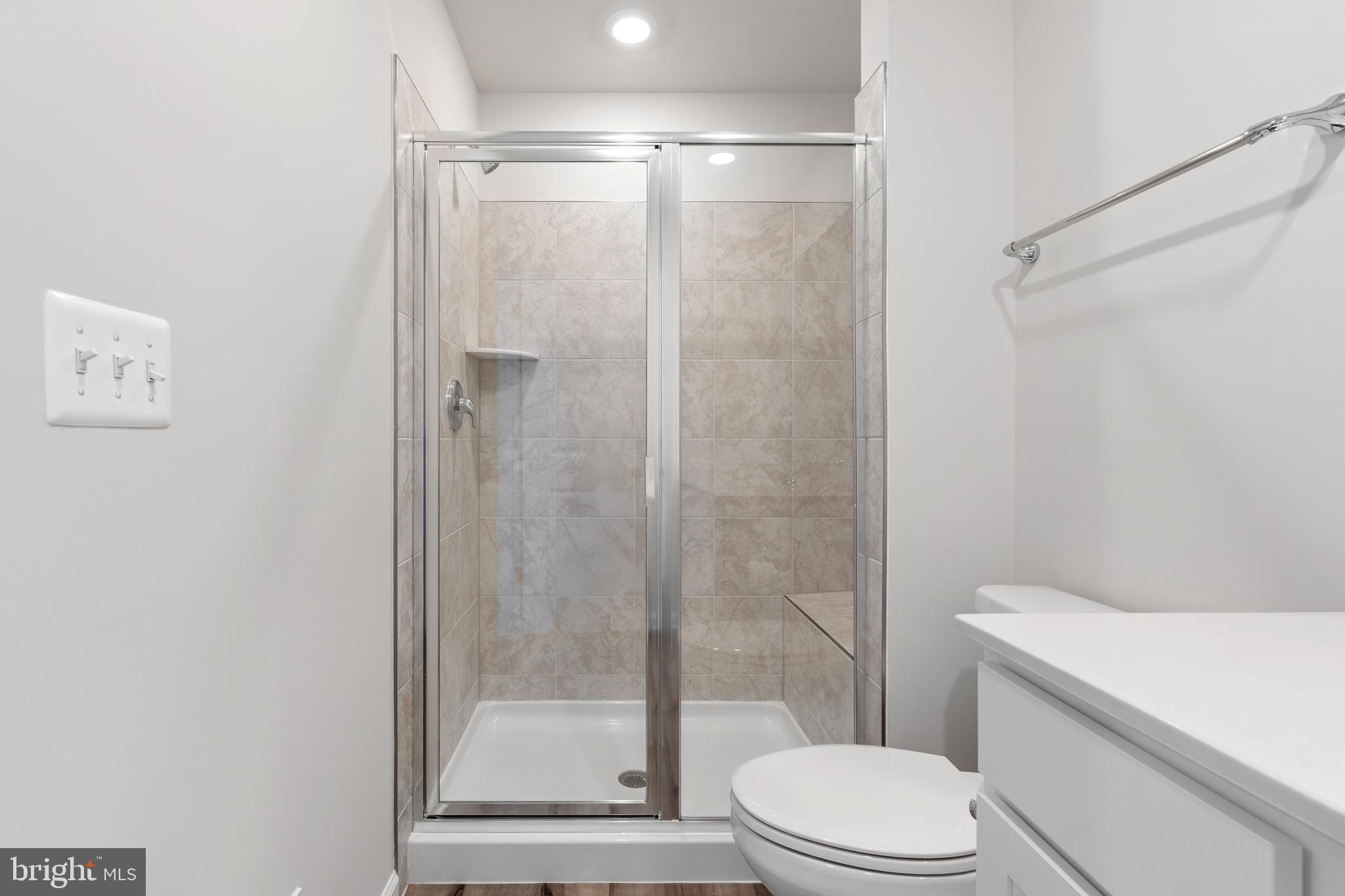 271 Sandy Btm Circle Ranson, WV 25438 - Photo 12 of 25 a bathroom with a toilet and a shower