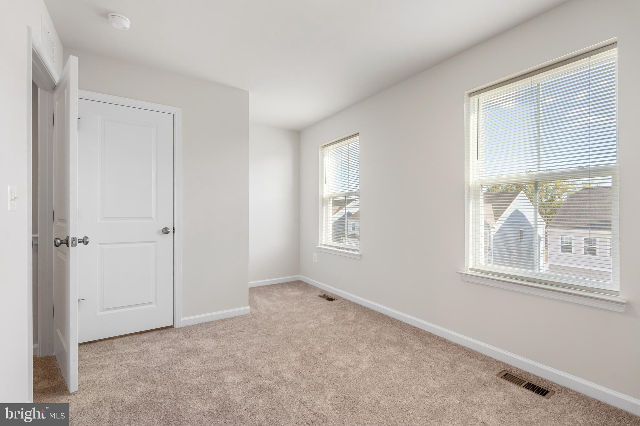 271 Sandy Btm Circle Ranson, WV 25438 - Photo 13 of 25 an empty room with windows