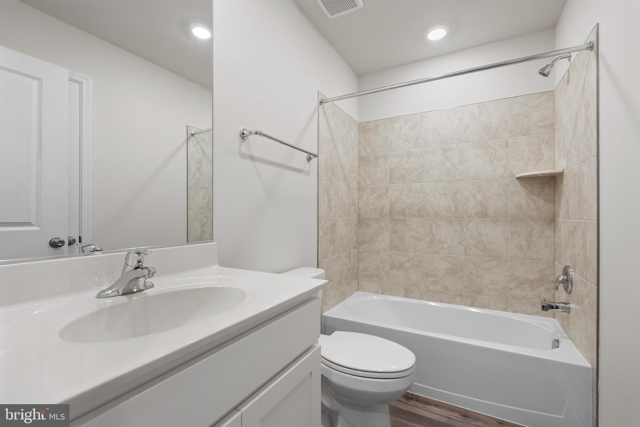 271 Sandy Btm Circle Ranson, WV 25438 - Photo 15 of 25 a bathroom with a sink toilet and shower