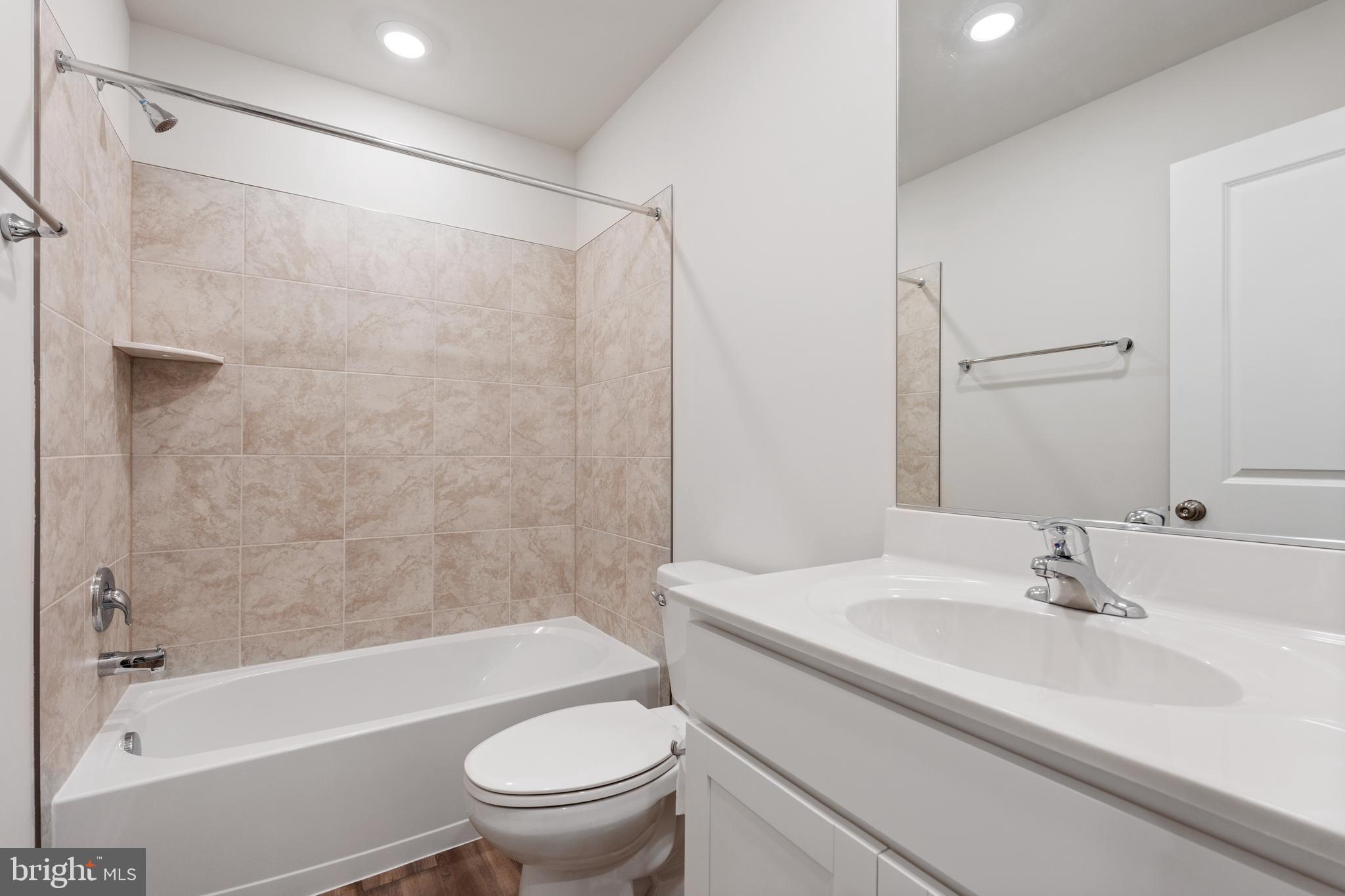 271 Sandy Btm Circle Ranson, WV 25438 - Photo 19 of 25 a bathroom with a sink toilet and shower