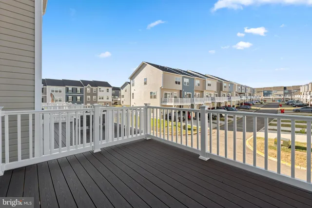 a view of a balcony with wooden floor