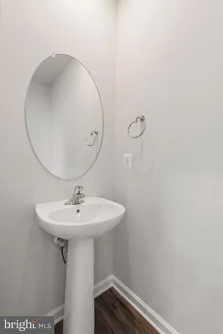a bathroom with a sink a mirror and vanity