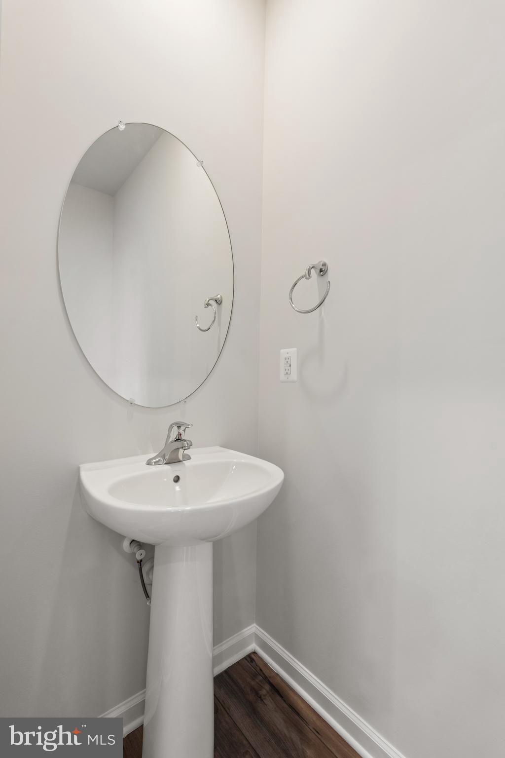 271 Sandy Btm Circle Ranson, WV 25438 - Photo 8 of 25 a bathroom with a sink a mirror and vanity