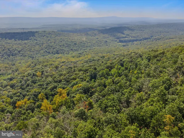 a view of a field with an outdoor space