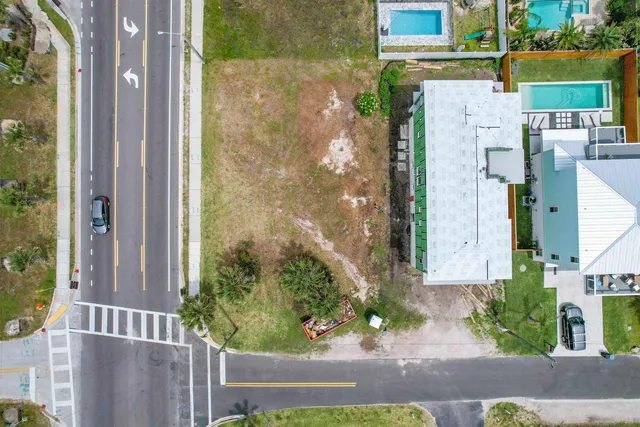 a aerial view of a house with a yard and plants