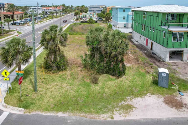 a backyard of a house with a yard and outdoor seating