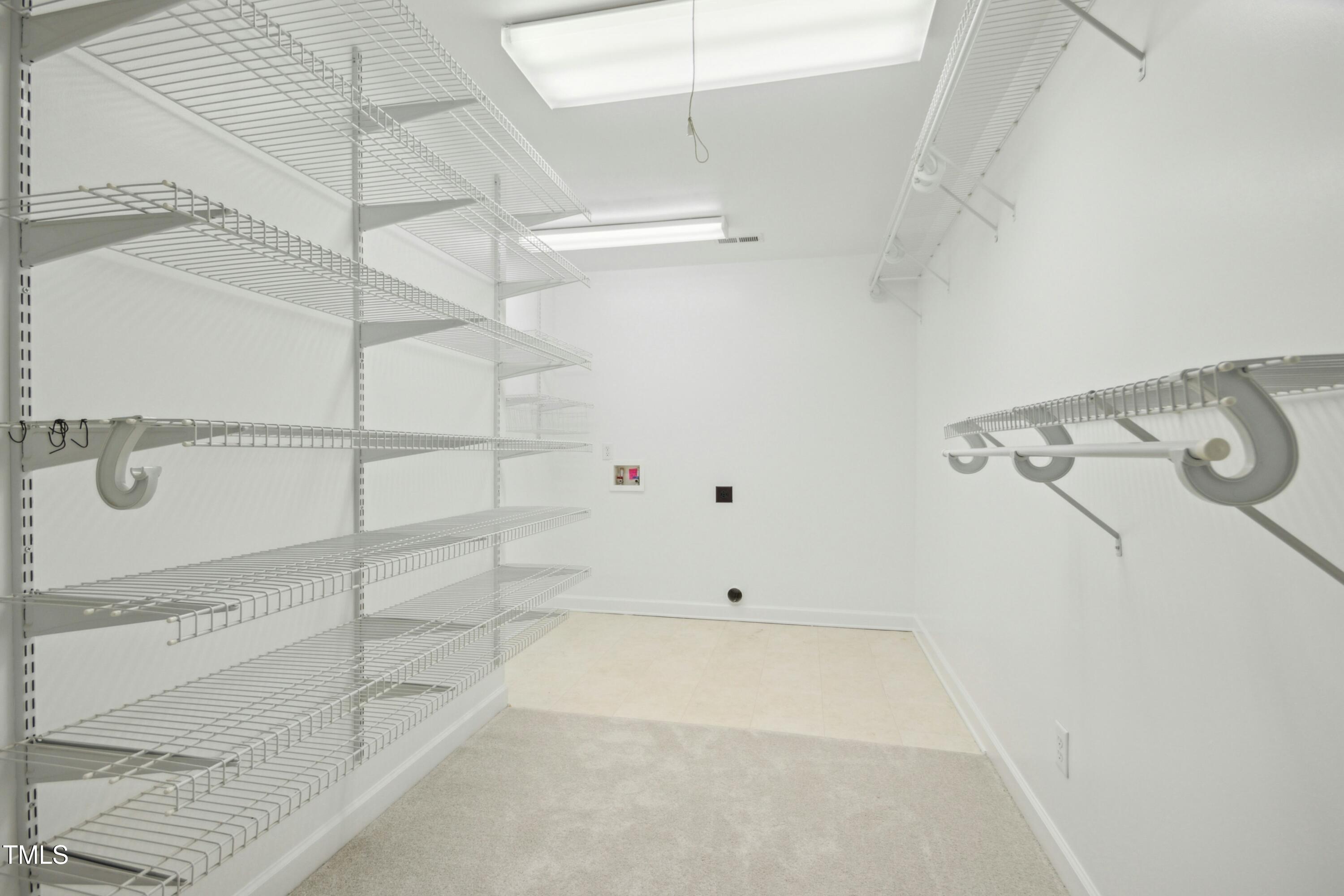 8808 Limestone Court Raleigh, NC 27615 - Photo 28 of 64 Closet with Laundry Room