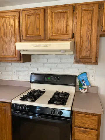 a close view of sink and cabinets