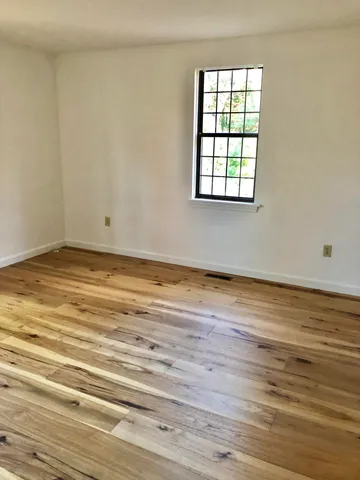 a bathroom with a toilet and a shower curtain