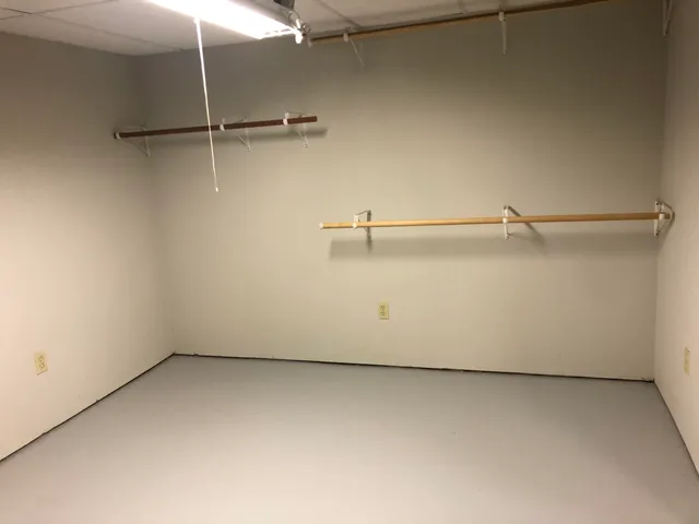 a view of a street sign under a large tree