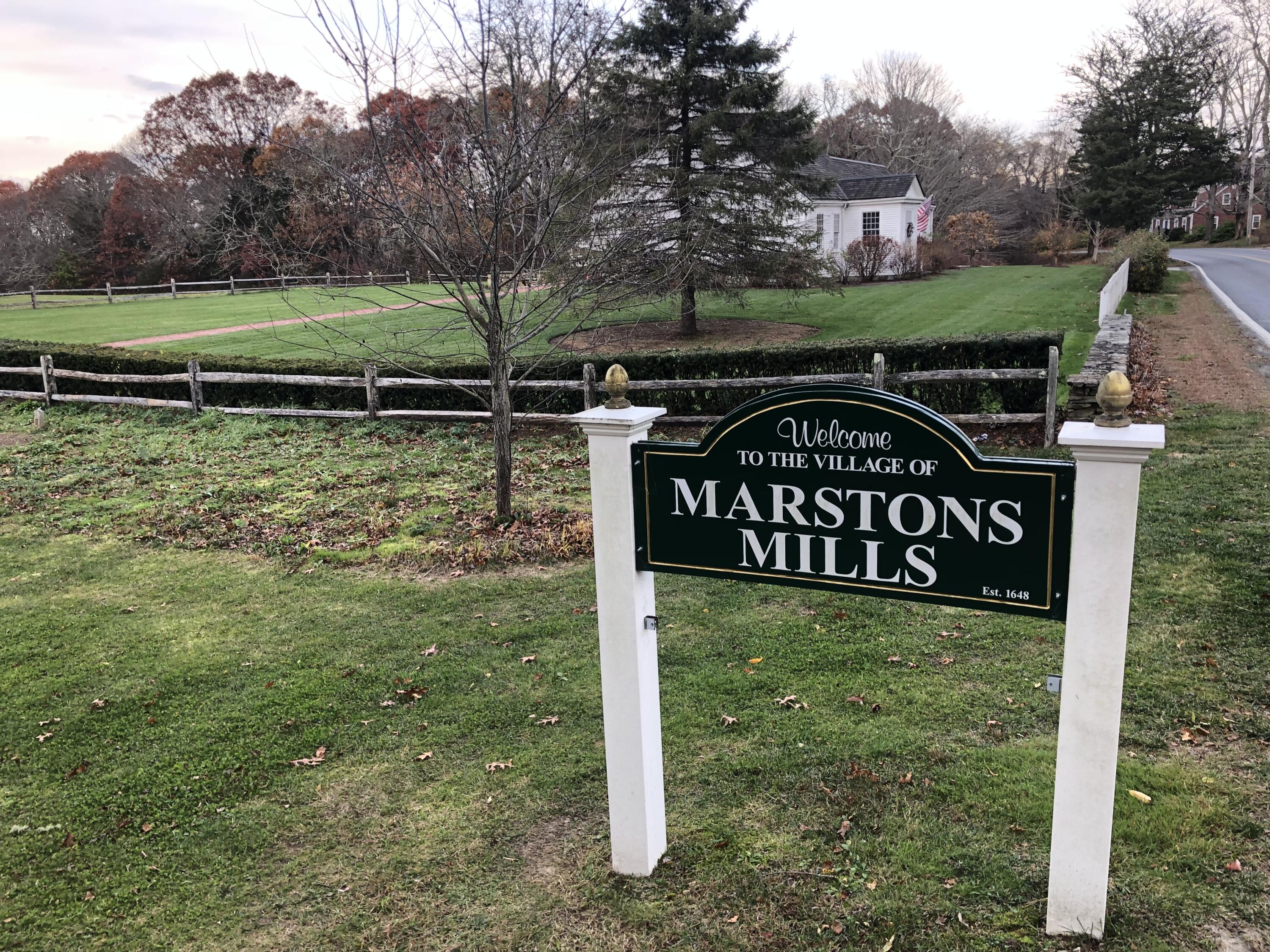 5 Conaumet Road Marstons Mills, MA 02648 - Photo 33 of 44 a view of a street sign under a large tree