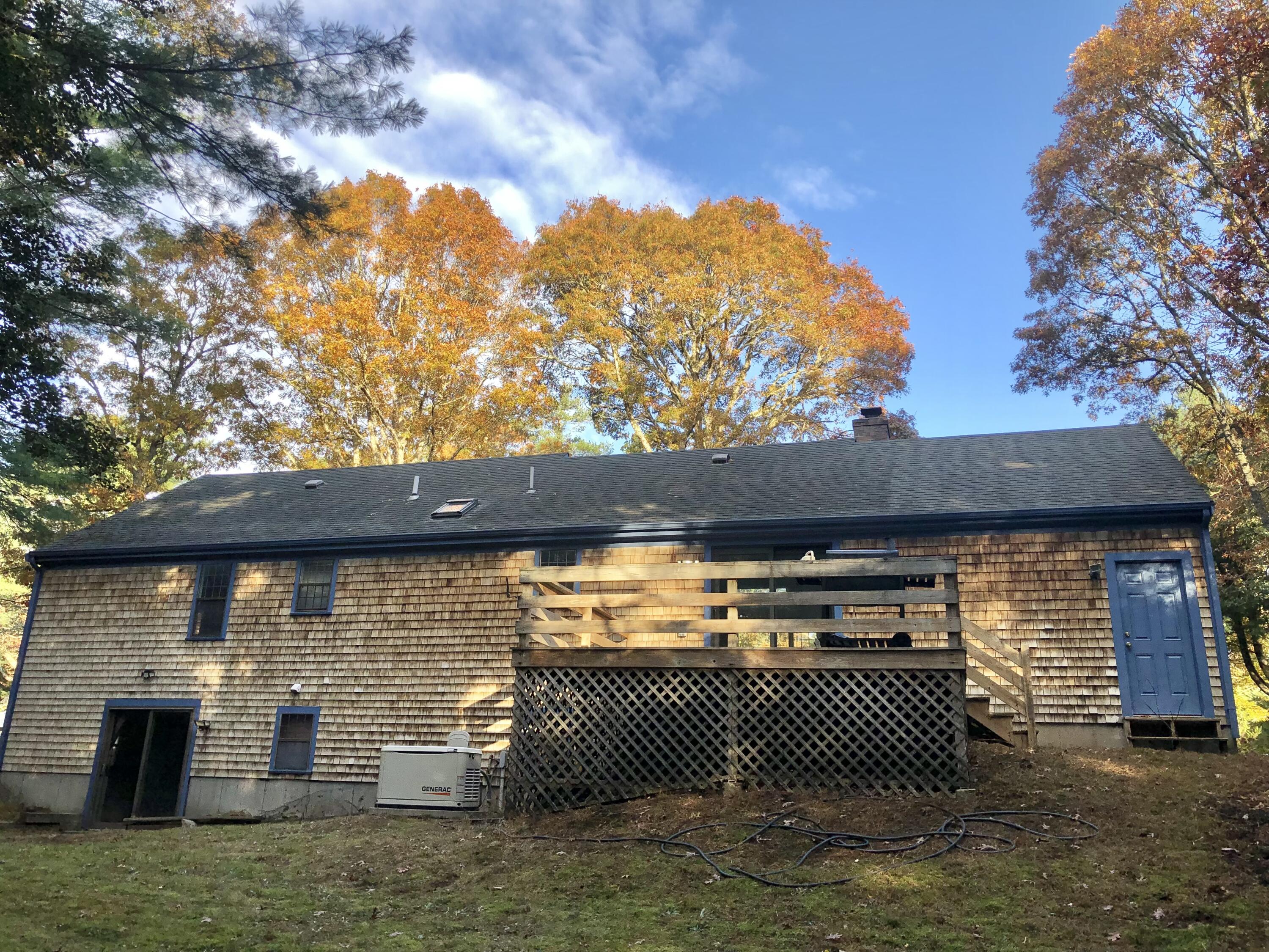 5 Conaumet Road Marstons Mills, MA 02648 - Photo 7 of 44 a backyard of a house with a barbeque