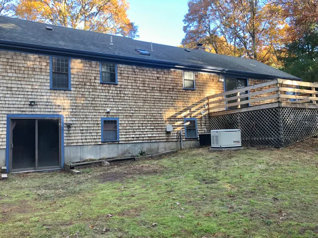 a backyard of a house with lots of green space