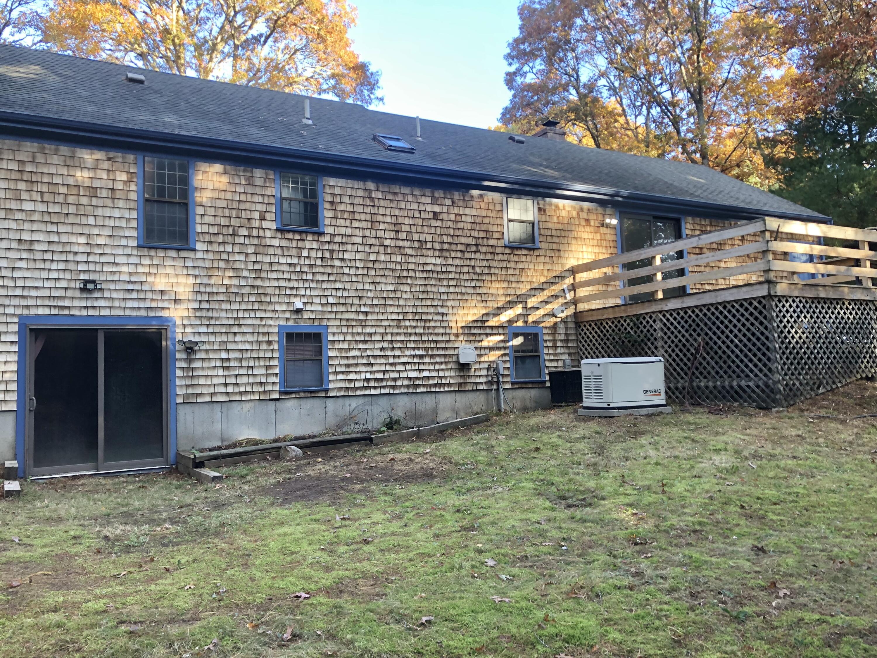5 Conaumet Road Marstons Mills, MA 02648 - Photo 8 of 44 a backyard of a house with lots of green space