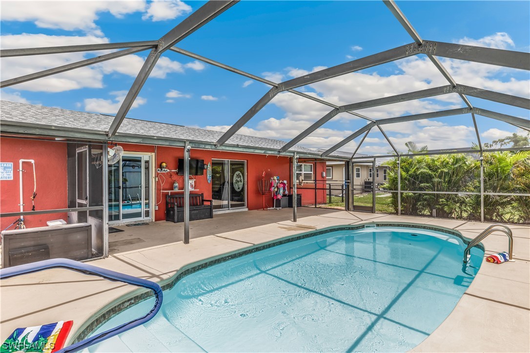 18454 Geranium Road Fort Myers, FL 33967 - Photo 1 of 17 a swimming pool with outdoor seating and yard