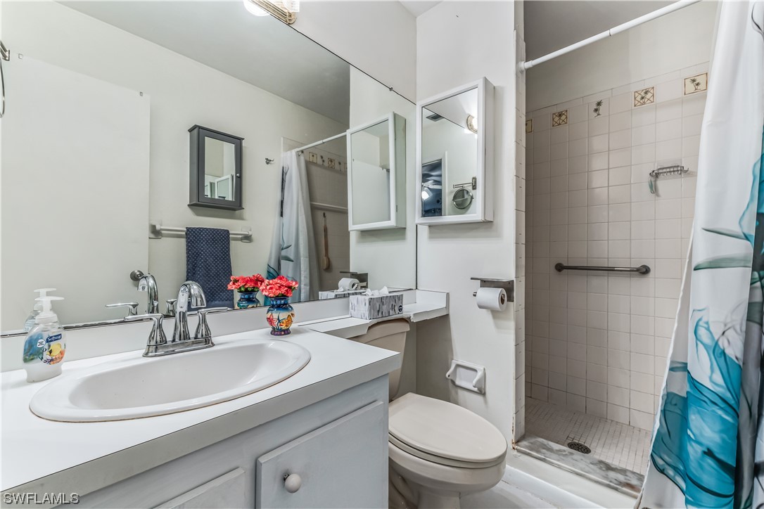 18454 Geranium Road Fort Myers, FL 33967 - Photo 12 of 17 a bathroom with a sink toilet and shower