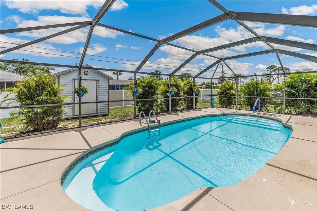 18454 Geranium Road Fort Myers, FL 33967 - Photo 2 of 17 a swimming pool with a outdoor seating