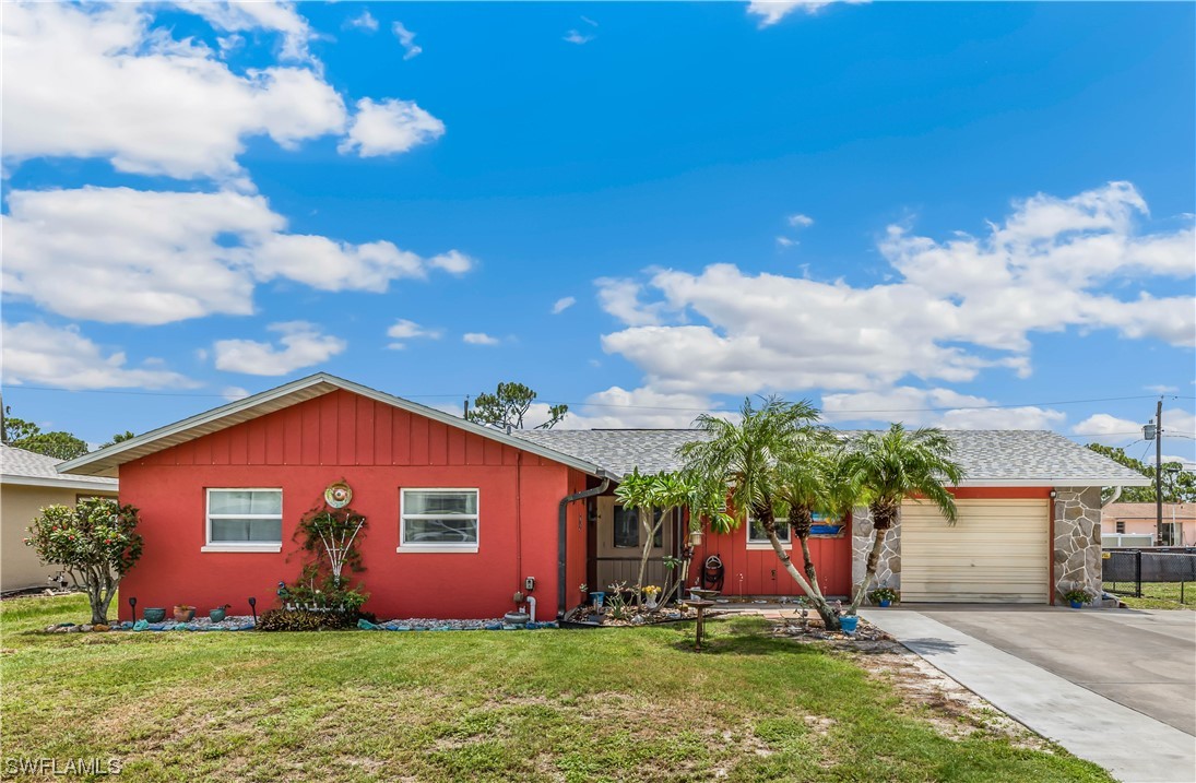 18454 Geranium Road Fort Myers, FL 33967 - Photo 4 of 17 a front view of house with yard and trees