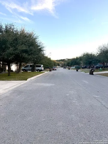 a view of a road with houses