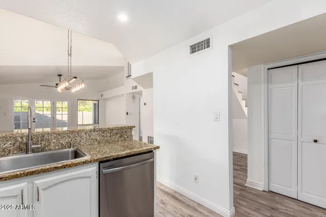 a view of a kitchen counter space and wooden floor