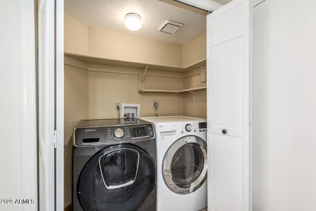 a utility room with dryer and washer