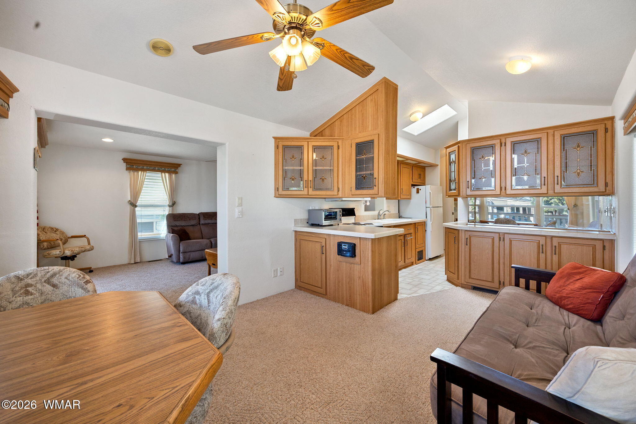 2221 Wrangler Way Overgaard, AZ 85933 - Photo 11 of 24 a living room with furniture and kitchen view