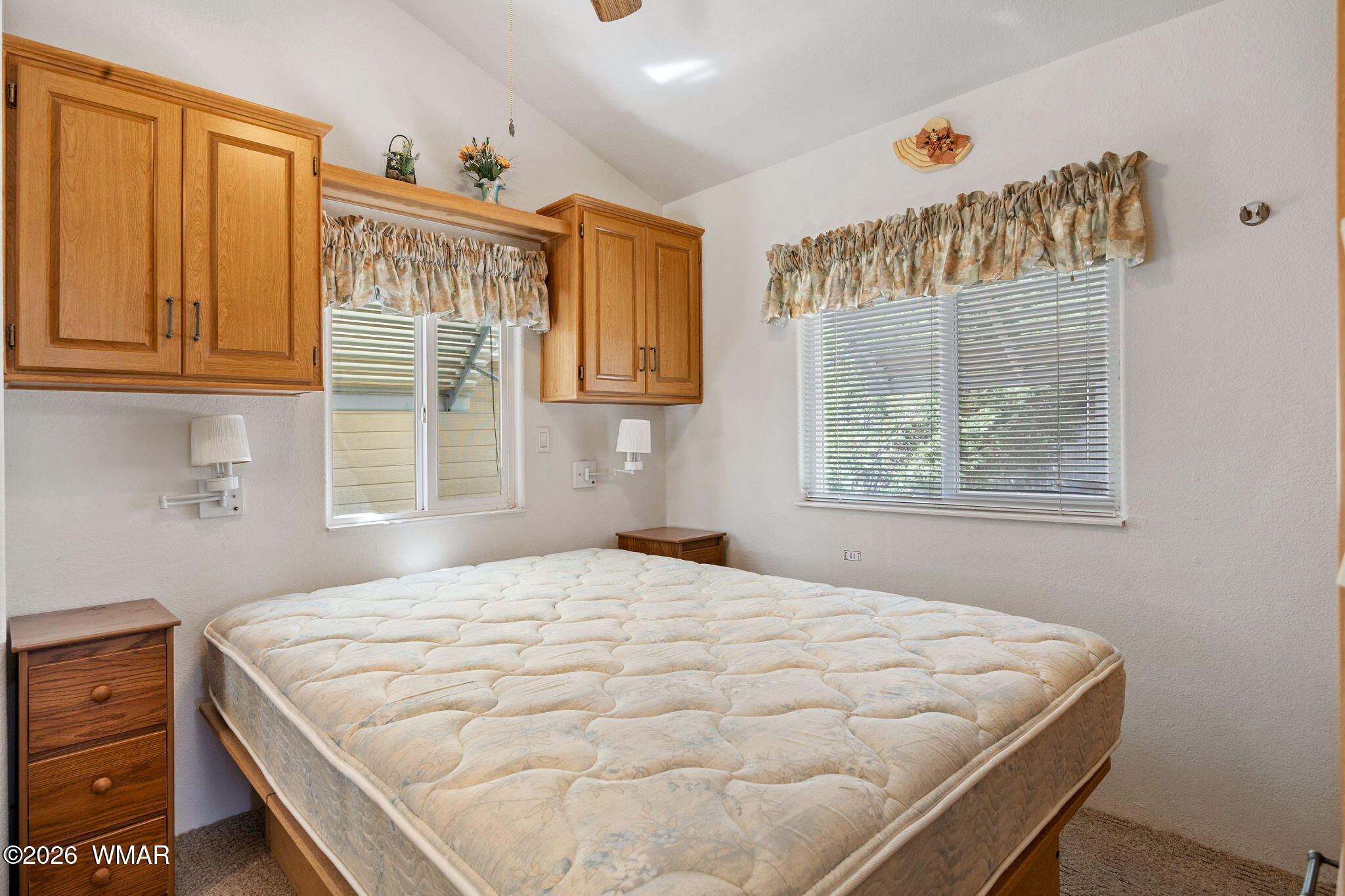 2221 Wrangler Way Overgaard, AZ 85933 - Photo 15 of 24 a bedroom with a bed and a window