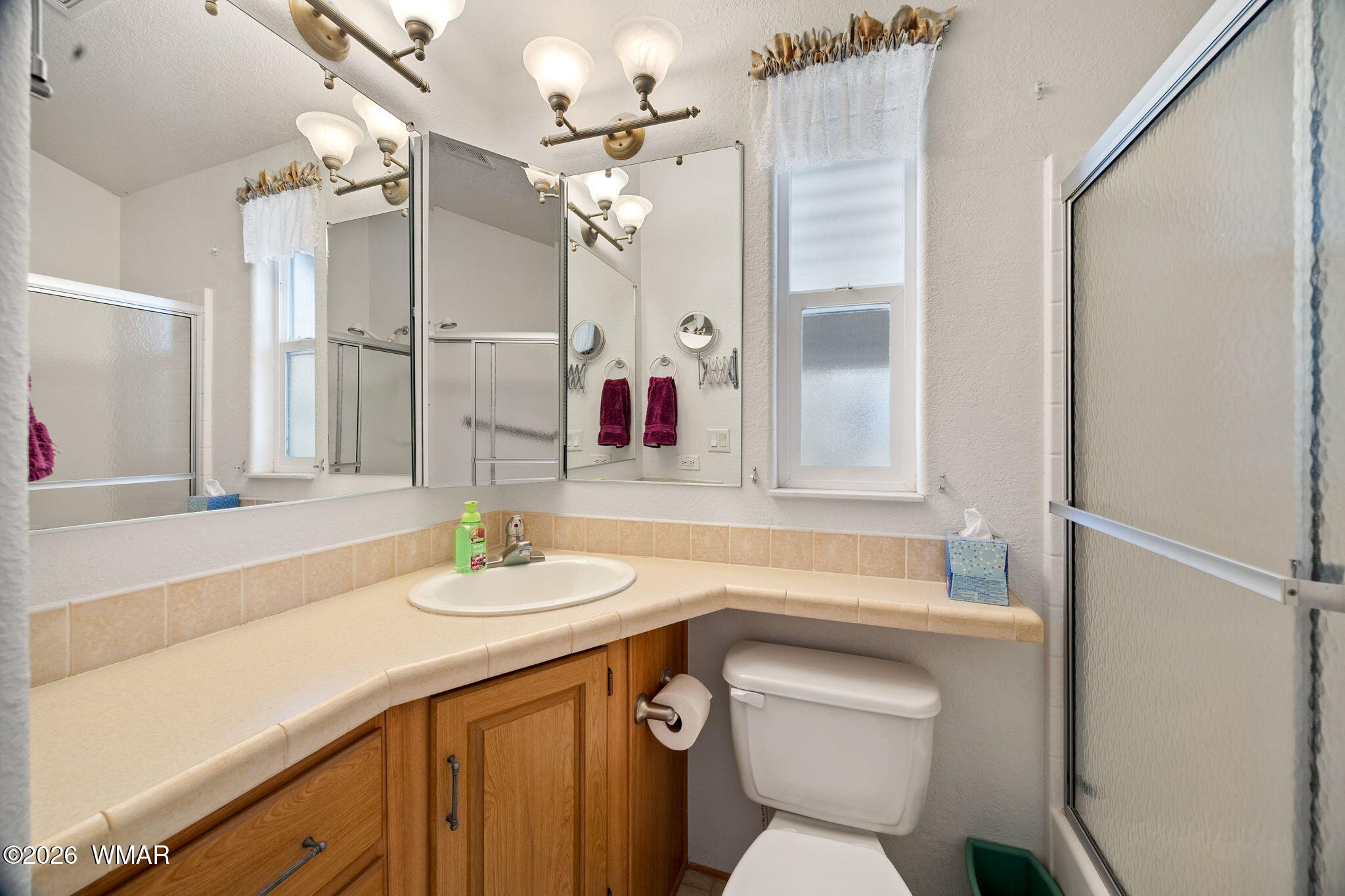 2221 Wrangler Way Overgaard, AZ 85933 - Photo 17 of 24 a bathroom with a sink and a mirror
