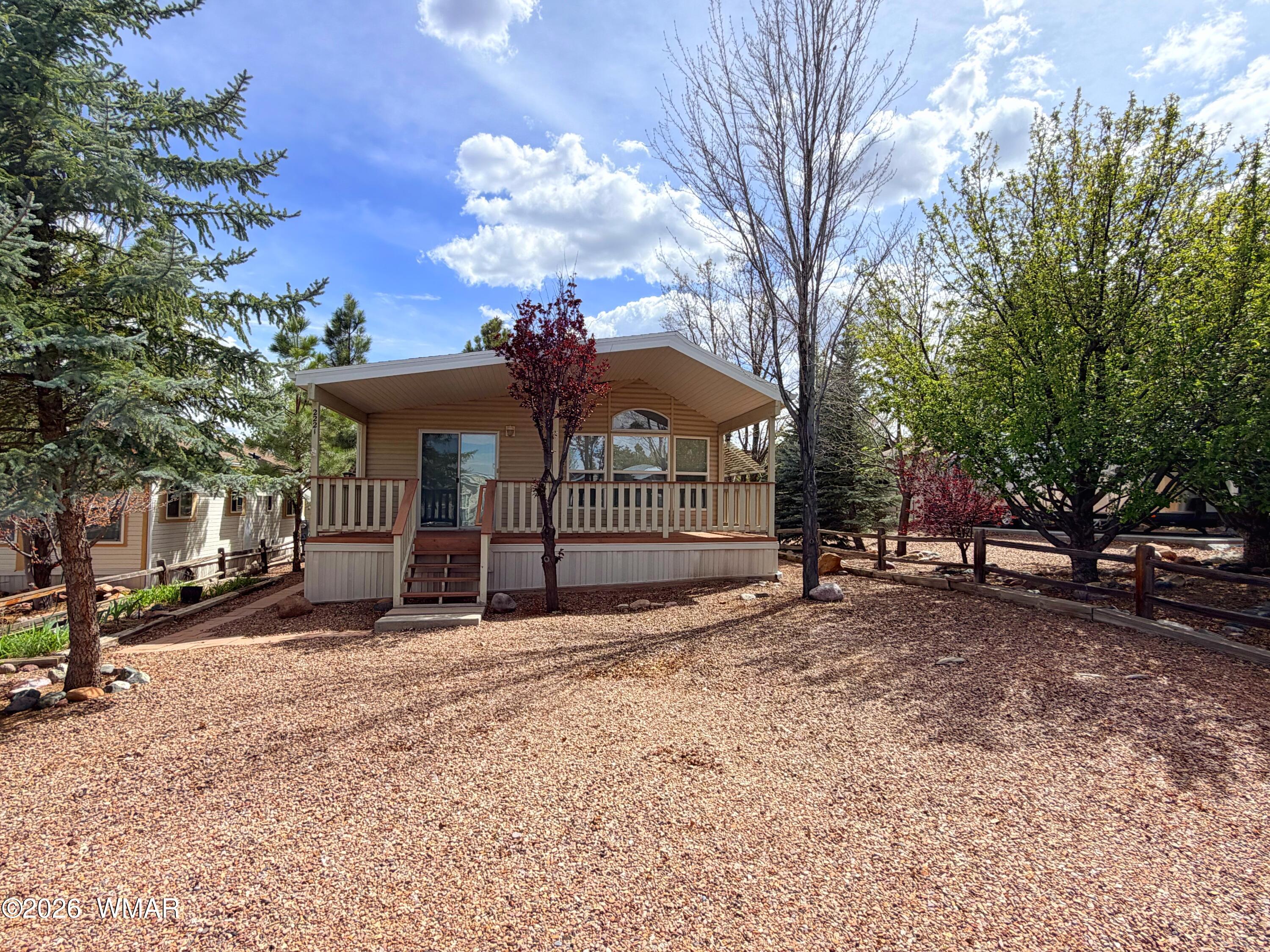 2221 Wrangler Way Overgaard, AZ 85933 - Photo 2 of 24 a view of a house with a snow in a yard