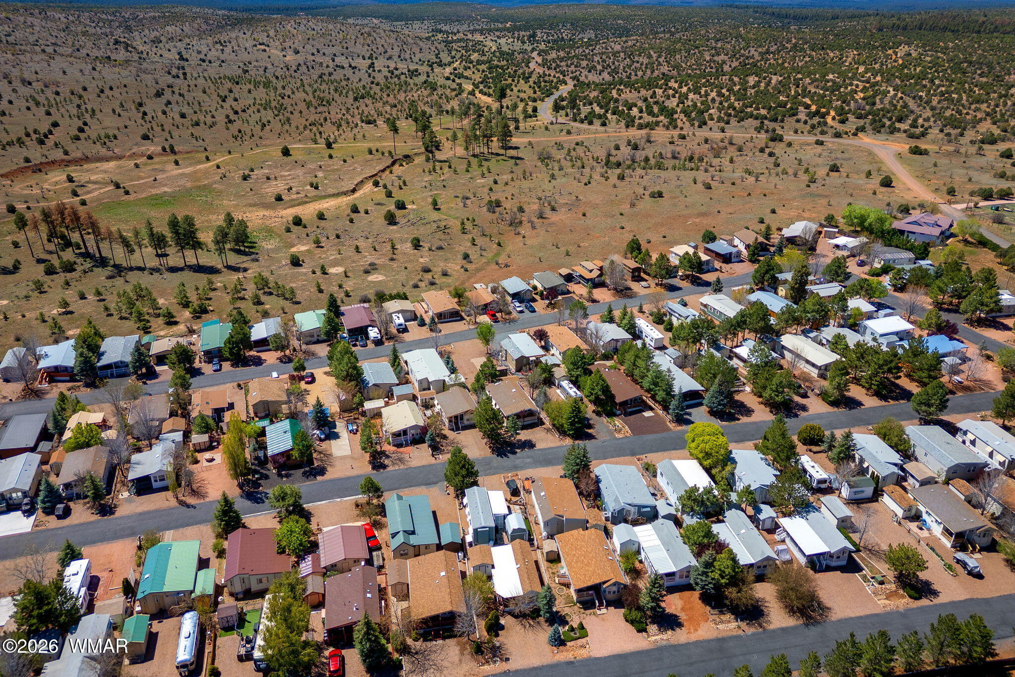 2221 Wrangler Way Overgaard, AZ 85933 - Photo 24 of 24 an aerial view of house with yard and mountain view in back