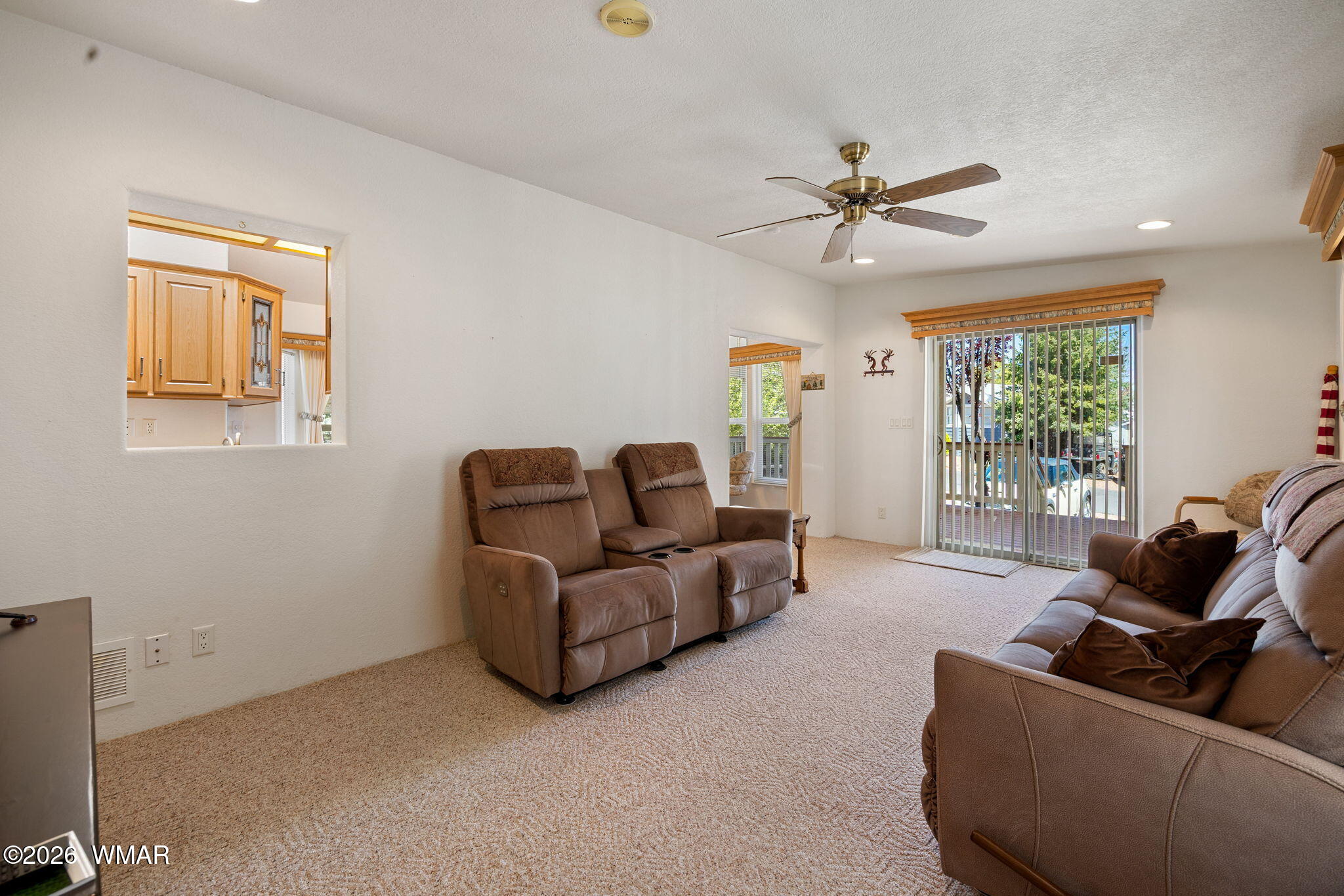 2221 Wrangler Way Overgaard, AZ 85933 - Photo 9 of 24 a living room with furniture and a window