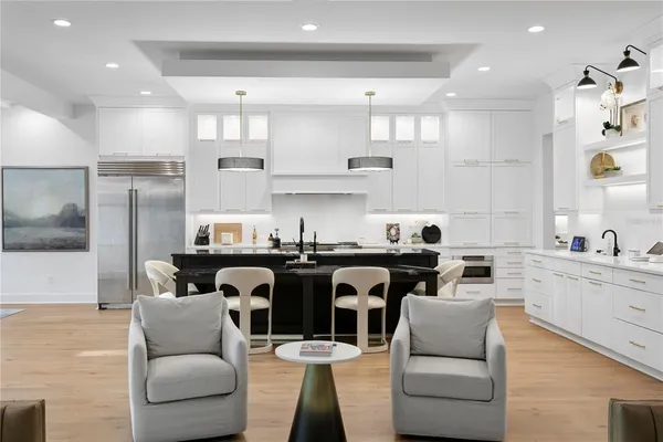 a view of walk in closet with clothes