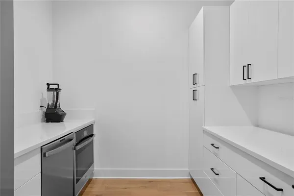 a spacious bathroom with a double vanity sink and a mirror